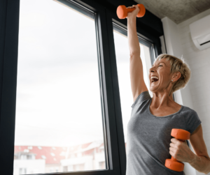 Senior woman exercising with dumbells