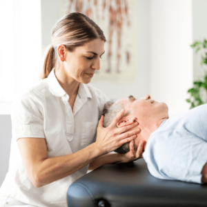 female physical therapist with male patient