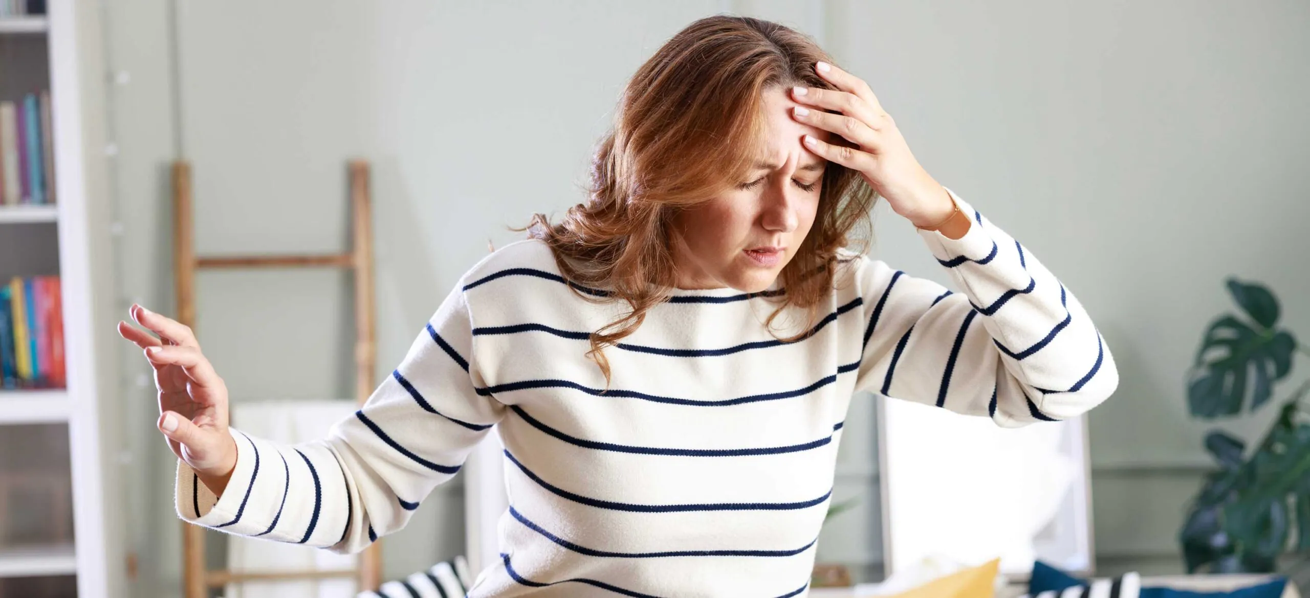 Young woman suffering from vertigo or dizziness problem of brain or inner ear